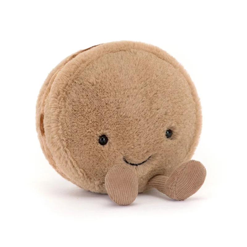 Front view of the Jellycat Amuseable Mona Macaron, featuring a soft chocolate fur with a stitched smile and cordy cocoa feet.