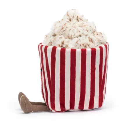 Side view of the Jellycat Amuseable Popcorn, highlighting the texture of the fluffy popcorn and the soft striped bucket.