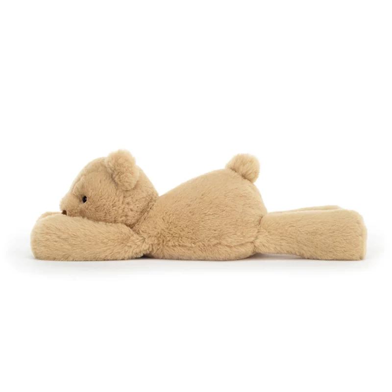 Side view of Jellycat Smudge Bear, highlighting its soft fur and squishy tummy.