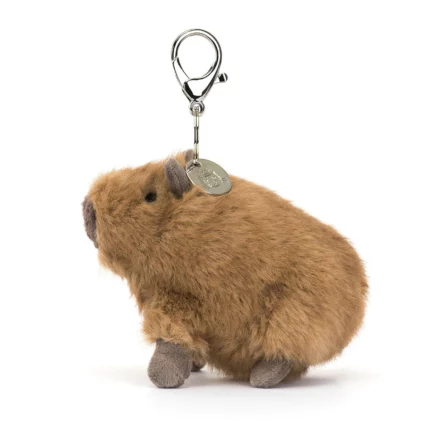 Side view of the Jellycat Clyde Capybara Bag Charm, highlighting the silver claw clip and its textured fur details.