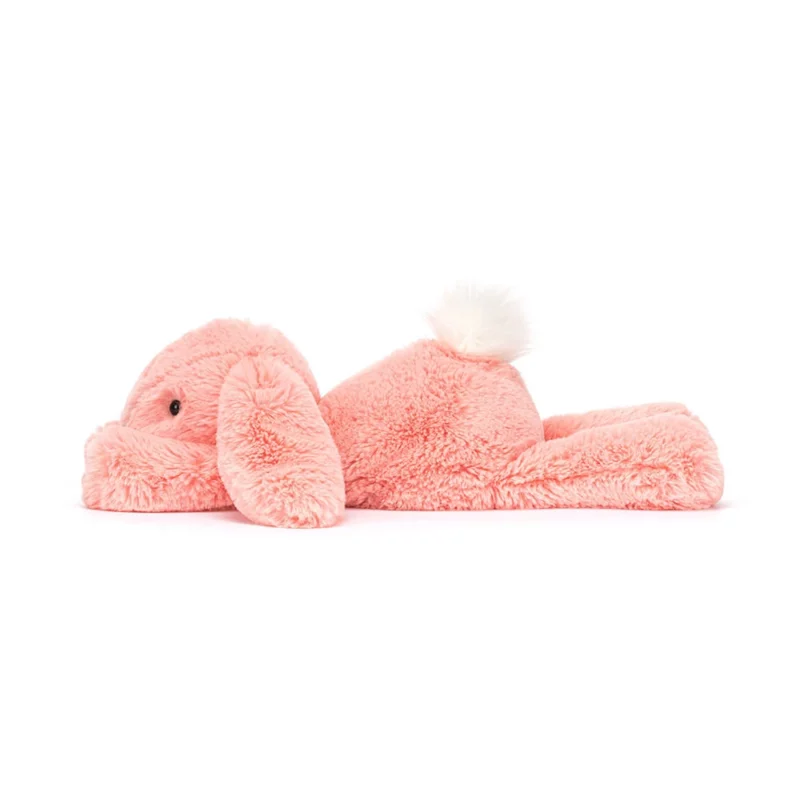 Side view of the Jellycat Smudge Apricot Bunny, highlighting its luxuriously soft fur and floppy trumpet legs.