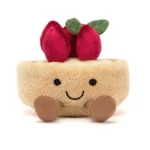 Alternative front view of the Jellycat Amuseable Fleurette Tarte Aux Fraises, emphasising its embroidered smile, soft pastry base, and cute plush strawberries.