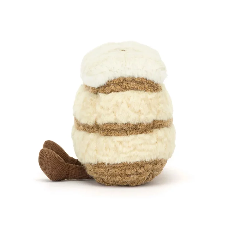 Side view of the Jellycat Amuseable Milie Mille Feuille, highlighting its soft pastry layers, smooth cream filling, and fine cord boots.