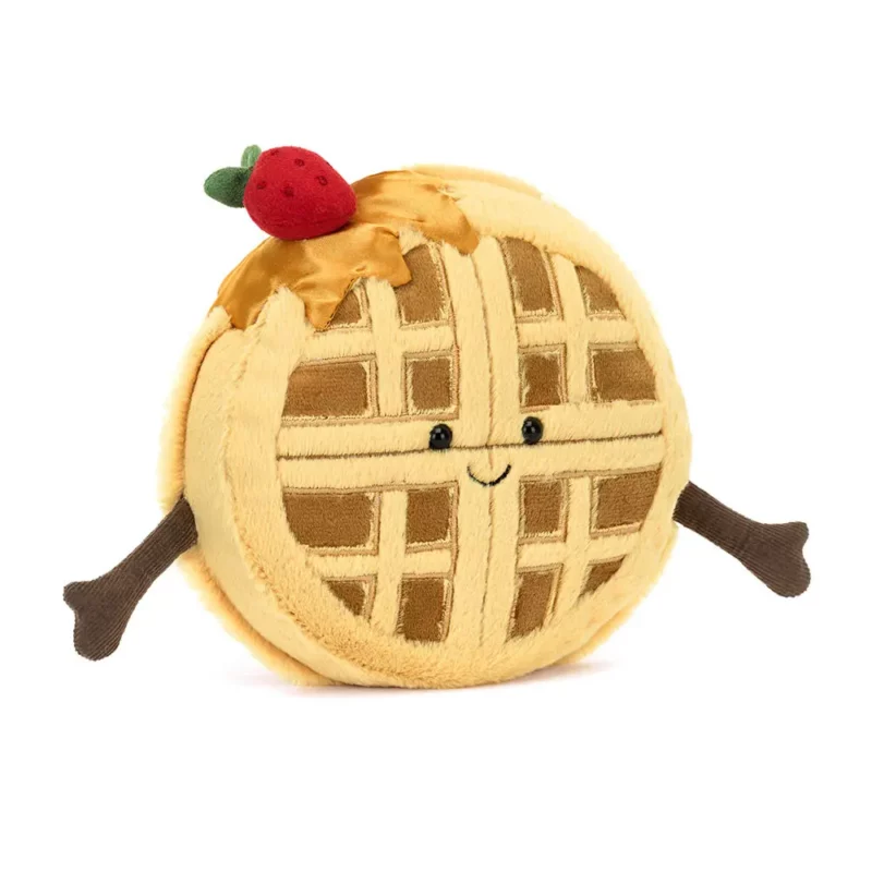 Front view of the Jellycat Amuseable Rene Waffle, showing its golden toasted texture, silky syrup drizzle, and soft red strawberry topper.