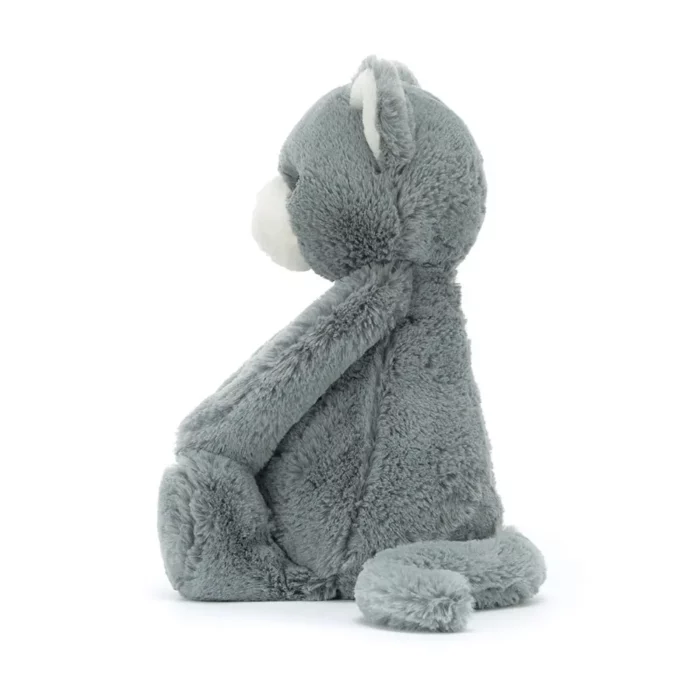 Side view of the Jellycat Bashful Kitten, highlighting its plush texture and curled tail.