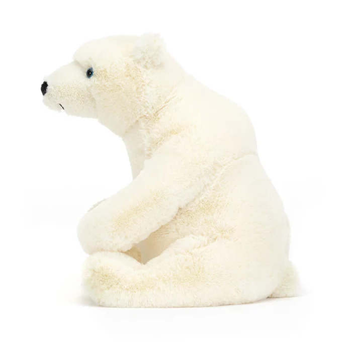 Side view of the small sized Jellycat Elwin Polar Bear, highlighting its soft, cream-coloured plush fur, round belly, and neat little ears.