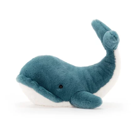 Side view of the medium sized Jellycat Wally Whale, highlighting its smooth teal fur, playful curved tail, and gentle embroidered eyes.