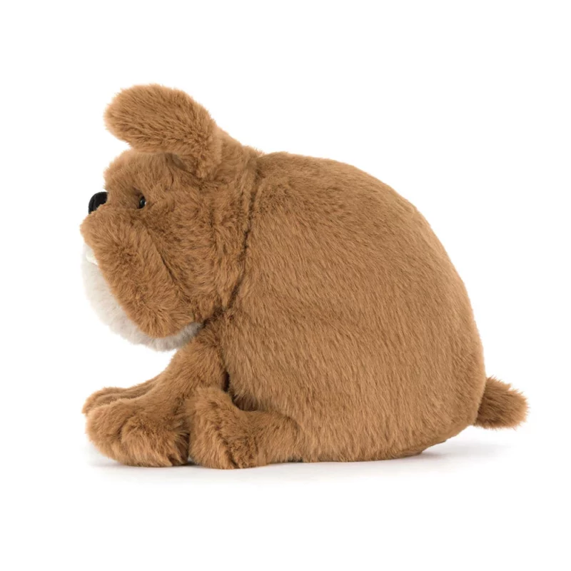 Side view of the Jellycat Derreck Dog, highlighting its rounded shape, floppy ears, and small tail.
