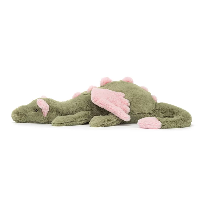 Side view of the Jellycat Malachy Dragon, showing its stretched out body and pastel pink detailing.