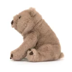 Side view of the Jellycat Wonda Wombat, showing rounded ears, long limbs, and textured claws.