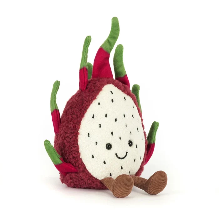 Front view of the Jellycat Amuseable Dragon Fruit featuring her smiling face, white speckled front, and cordy brown legs.