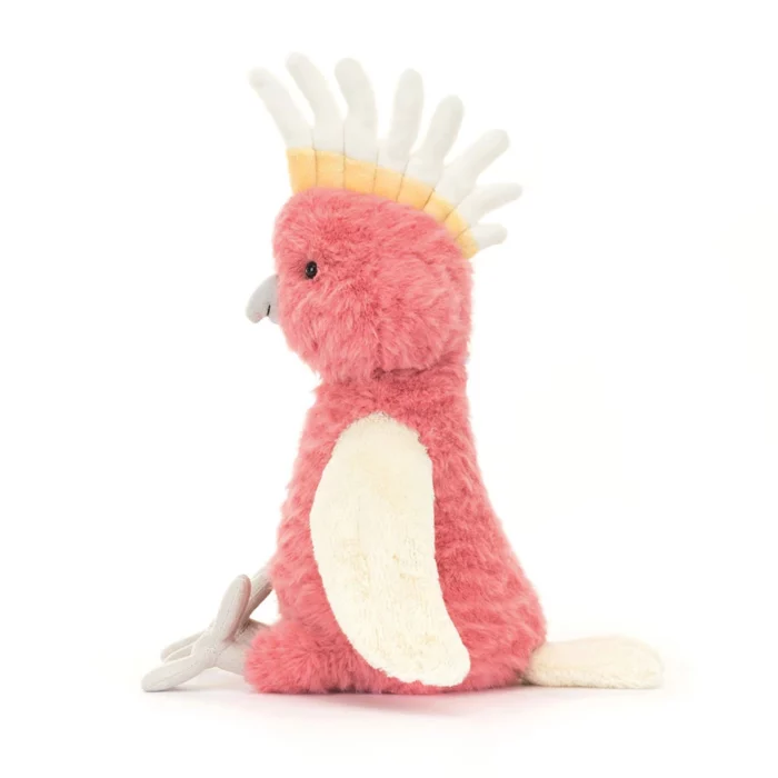 Side view of the Jellycat Squawkatoo highlighting her curved beak, colourful crest, and long tail.