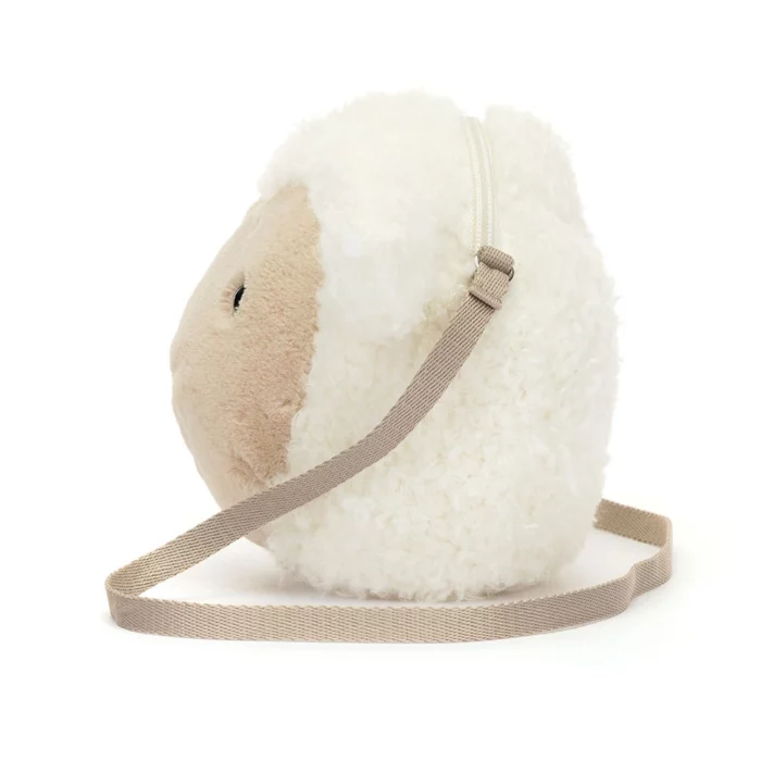 Side view of Jellycat Little Lamb Bag highlighting its fluffy fleece texture and beige strap detail.