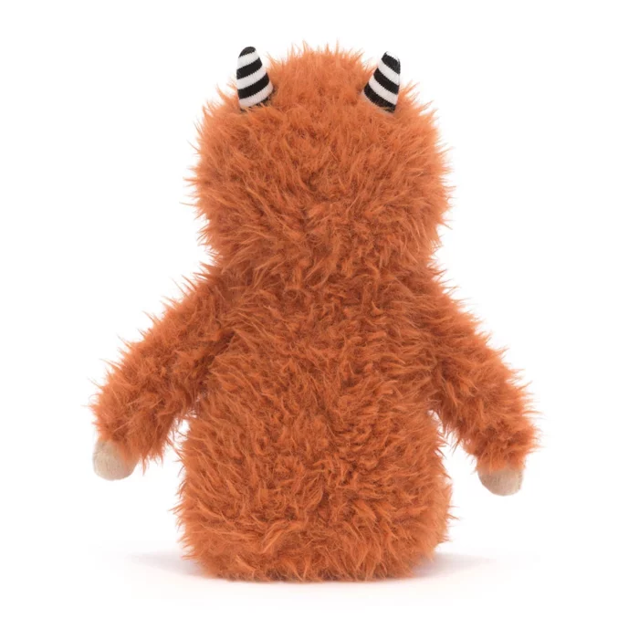 Rear view of Jellycat Pip Monster highlighting its plush ginger back and striped horns.