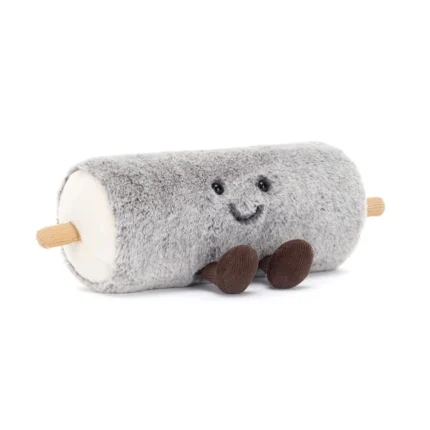 Front view of Jellycat Amuseable Goat Cheese showing its fuzzy grey rind, stitched smile, and cordy legs.