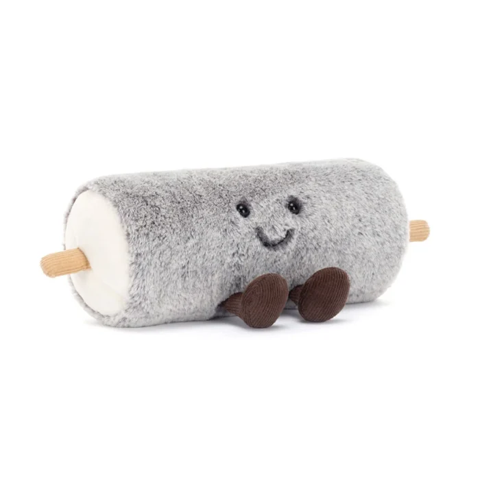 Front view of Jellycat Amuseable Goat Cheese showing its fuzzy grey rind, stitched smile, and cordy legs.