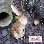Rabbit Metal Garden Ornament displayed on slate chippings next to other woodland figures.