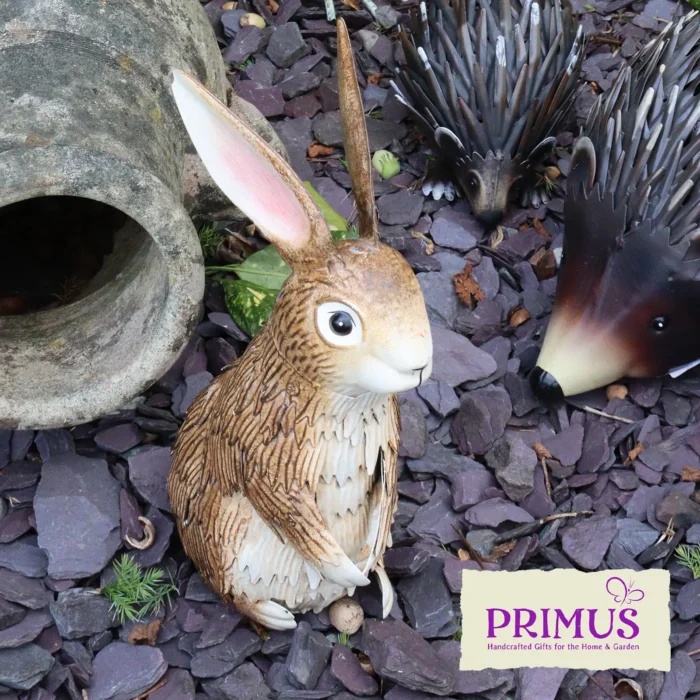 Rabbit Metal Garden Ornament displayed on slate chippings next to other woodland figures.