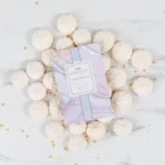 Greenleaf Vanilla Dream Scented Sachet displayed with meringues and sprinkles.
