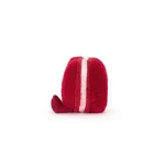 Side view of Jellycat Amuseable Arlette Heart Macaron, showing the layered pink filling and soft red fur.