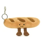 Alternative front view of Jellycat Amuseable Baguette Bag Charm, with stitched smile, fluffy bread texture, and cordy brown legs.