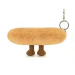 Rear view of Jellycat Amuseable Baguette Bag Charm, highlighting the soft golden-brown plush back and keychain clasp.