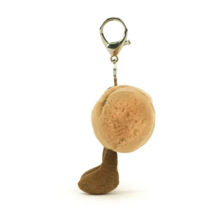 Side view of Jellycat Amuseable Baguette Bag Charm, showing the round shape and plush texture from a side angle.