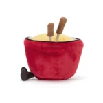 Side view of Jellycat Amuseable Cheese Fondue, highlighting the red plush pot shape, textured cheese filling, and soft side handles.