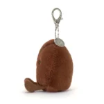 Side view of Jellycat Amuseable Coffee Bean Bag Charm, showing the fuzzy brown texture and attached silver keyring.