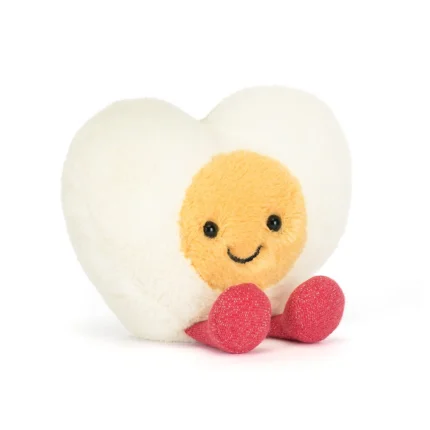 Front view of Jellycat Amuseable Heart Boiled Egg, showing its golden yolk face, bright eyes, and sparkly red feet.