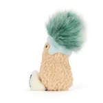 Side view of Jellycat Amuseable Peanut 'Après Ski', highlighting the detailed nutty texture and the soft winter hat with ear flaps.