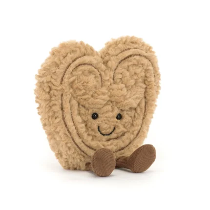 Front view of Jellycat Amuseable Philippe Palmier, showcasing its smiling embroidered face, swirled pastry detail, and corduroy brown feet.