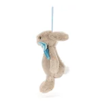 Side view of Jellycat Bashful Beige Bunny Decoration, highlighting its profile, floppy ear, and white tail.