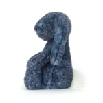 Side view of Jellycat Bashful Hopscone Luxe Bunny, showing the speckled plush coat and sitting pose.