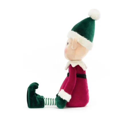 Side view of Jellycat Eldo Elf, showing the plush profile, pointy ears, and striped green-and-white tights.