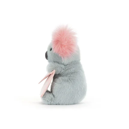 Side view of Jellycat Koala With Message, with its pink ears fluffed out and envelope held in its tiny paws.