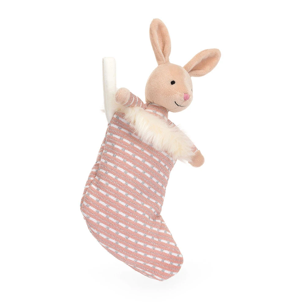 jellycat-shimmer-stocking-bunny-front Front view of Jellycat Shimmer Stocking Bunny, showing her pink-striped stocking with fluffy trim and cheerful bunny peeking out.