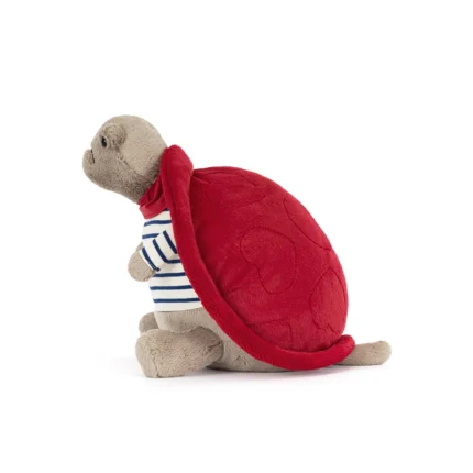 Side view of Jellycat Timmy Turtle Romantic Outfit, showing the soft red shell and blue-striped outfit with legs tucked in.