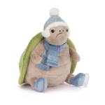Front view of Jellycat Timmy Turtle 'Skating', showing his serious expression, blue winter hat, and ice skates.