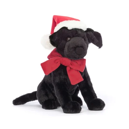 Front view of Jellycat Winter Warmer Pippa Labrador, wearing a red bow and Santa hat with soft black fur.
