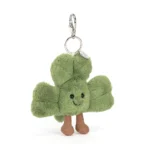 Front view of Jellycat Amuseable Siofra Shamrock Bag Charm showing soft green plush leaves, smiling face, and cordy legs.