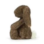 Side view of Jellycat Bashful Hoppleston Luxe Bunny showing plush brown fur and relaxed seated pose.