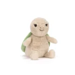 Front view of Jellycat Thimble Turtle showing beige plush body, embroidered smile, and green shell.