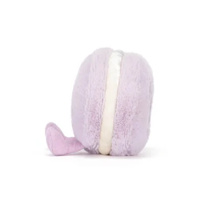Side view of Jellycat Amuseable May Macaron in lavender, highlighting the velvety cream filling and plush textured shell.