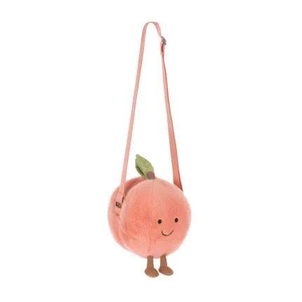 Front view of Jellycat Amuseable Peach Shoulder Bag with soft peach fur, stitched smile, brown cord legs and adjustable strap.