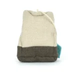 Rear view of Jellycat Amuseable Steepy Tea Bag highlighting the woven plush texture, stitched seam detailing, and tea string loop.