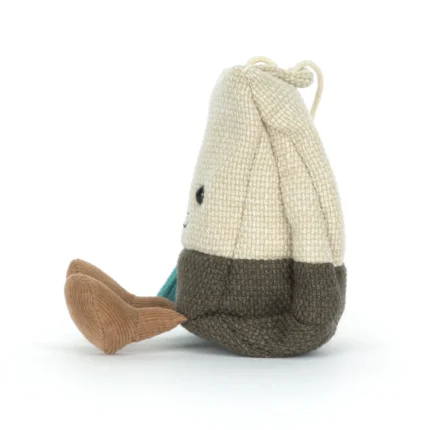 Side view of Jellycat Amuseable Steepy Tea Bag displaying textured fabric body, stitched tea string, and soft brown corduroy legs.