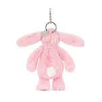 Rear view of Jellycat Blossom Blushkin Bunny Bag Charm highlighting the soft pink plush, fluffy white tail and silver keyring attachment.