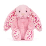 Alternative front view of Jellycat Blossom Blushkin Luxe Bunny Original featuring floral ears, rose print paw pads and velvety soft pink fur.