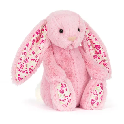 Front view of Jellycat Blossom Blushkin Luxe Bunny Original with soft pink fur, floral patterned ears and matching rose print paw pads.